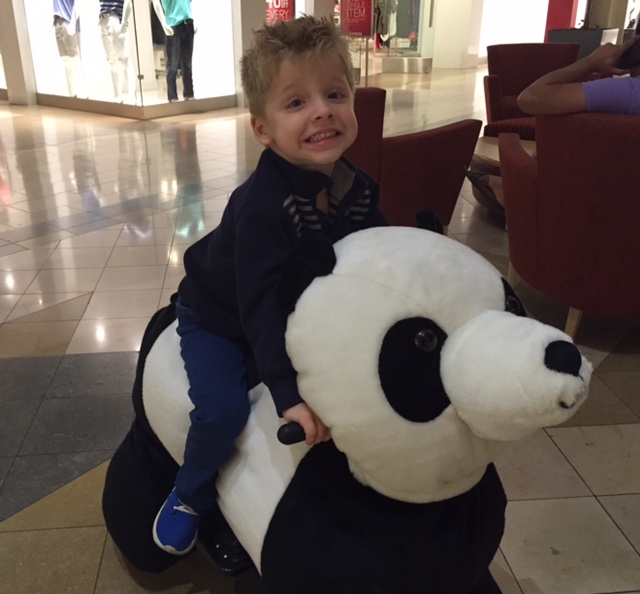 Boy on panda at NWA Mall, Fayetteville