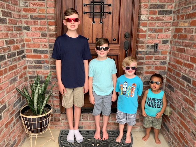 Photo of Allison Smith's four sons standing on the front porch