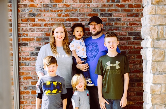 Picture of Allison Smith, her husband, and their four sons