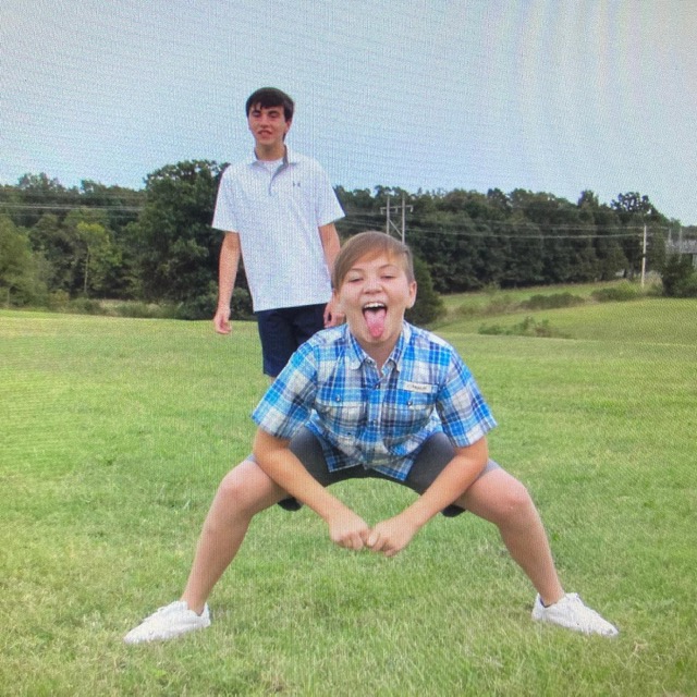 Kelli Jensen's boys play in the grass.